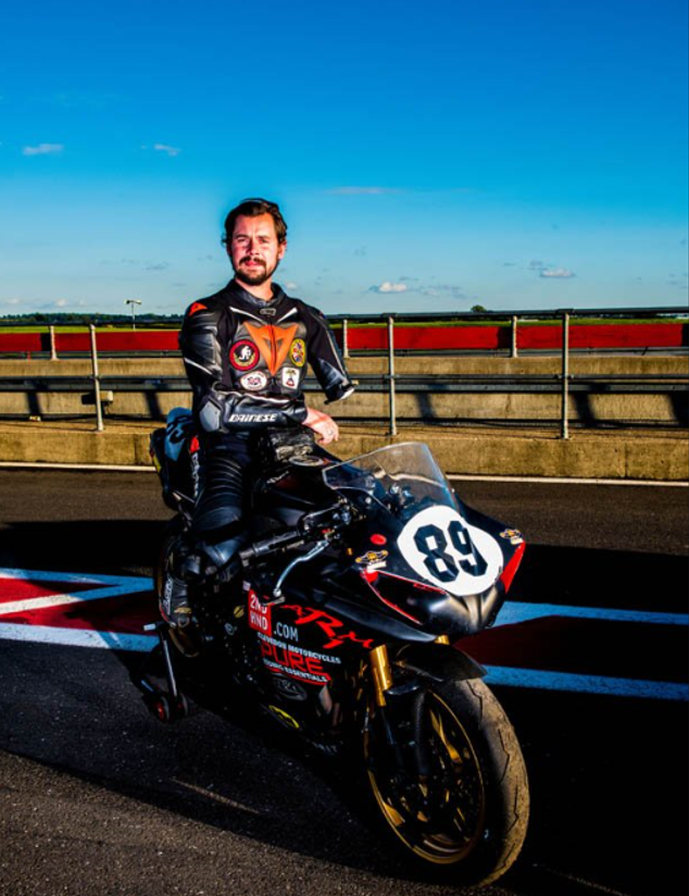 one armed motorcycle rider